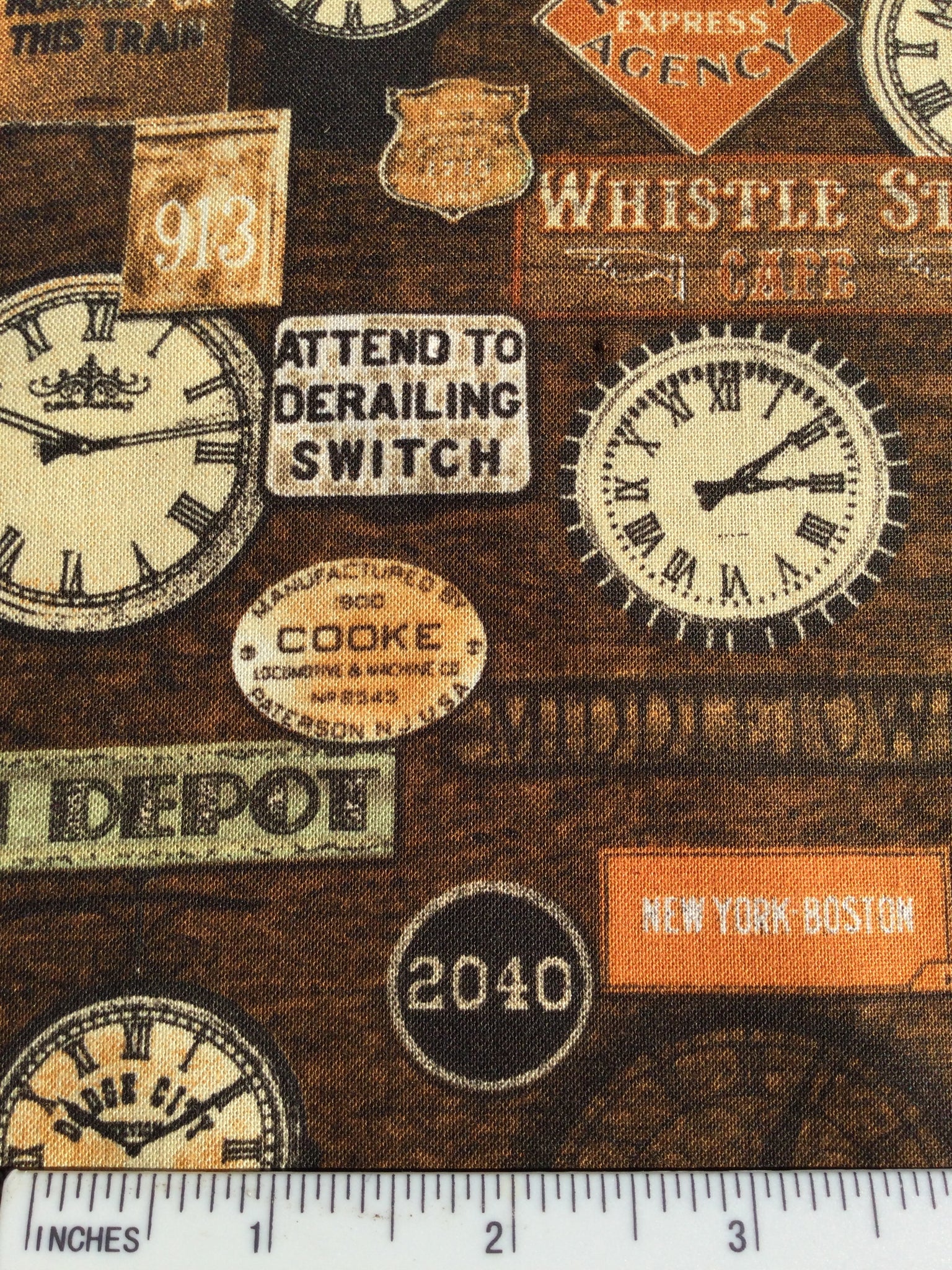 Locomotion  - M0098- Brown background with pictures of Train Station Signs and Clocks