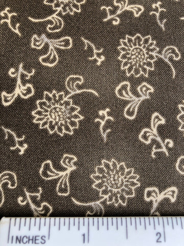 Traditions - FS388 - Taupe/ Brown background with Cream stylised floral print.